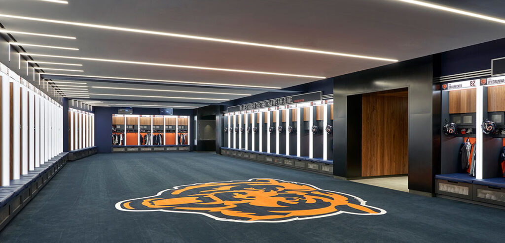 Inside the Bears’ Den | Slot-light patterns in the locker room allude to yard lines on a football field