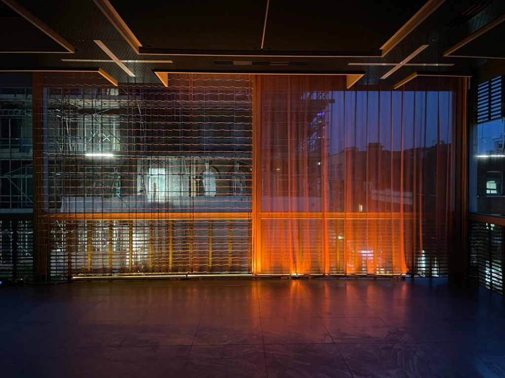 The Warm Glow In Soho | The designers relied on the theatrical effect of gauze curtain to help produce a copper glow