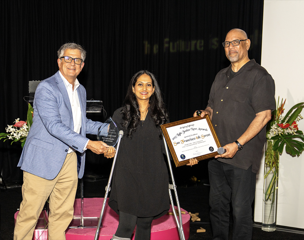 Diversity: Light Justice NOW Awards | Neha Sivaprasad, principal, Sol Light Studio receives an award from Randy Reid and Edward Bartholomew. | Photo: Druid Productions LLC.