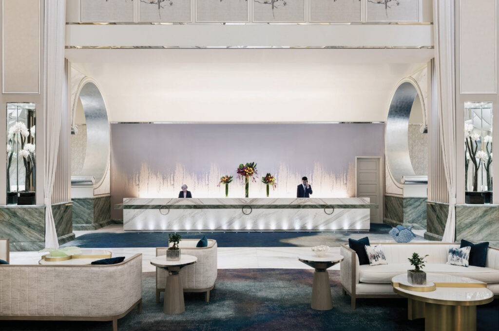 At Crockford’s lobby, variable white fixtures provide a cool crisp look through the day before warming the space considerably in the evening | Photo: Hilton & Resorts