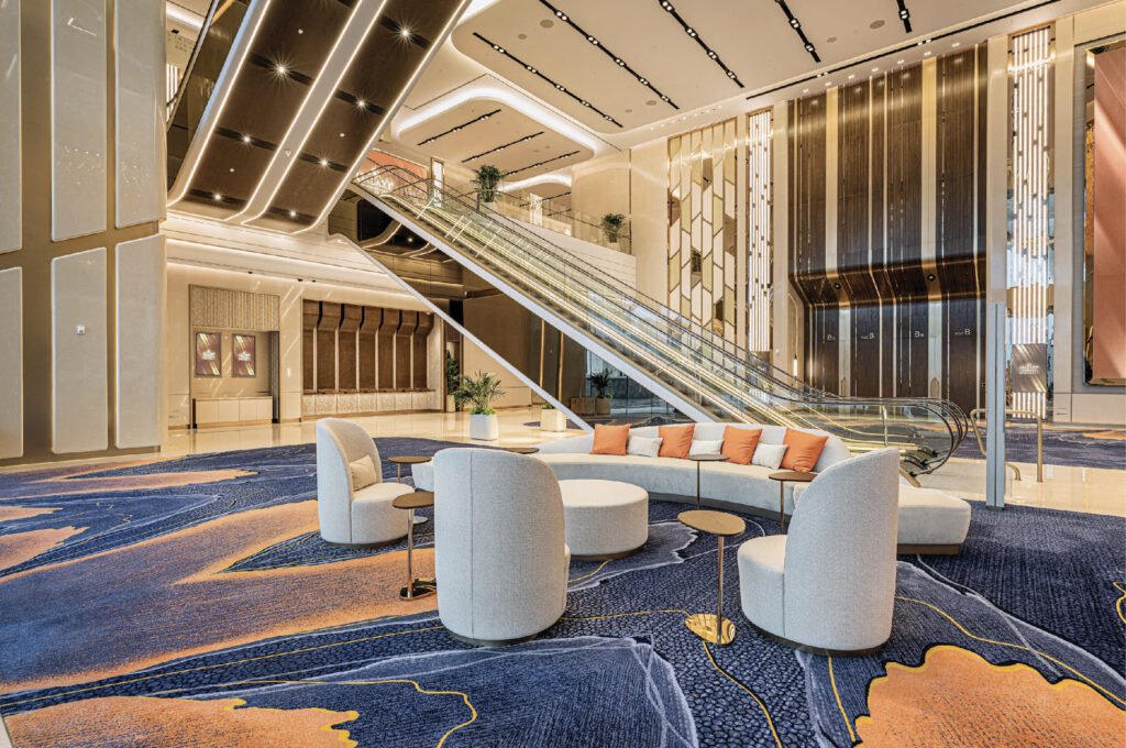 Multiple layers of light provide glitz and glamor in the pre-function spaces outside the Galaxy Arena and Convention Center. |  Photo: Steelman Partners LLC.