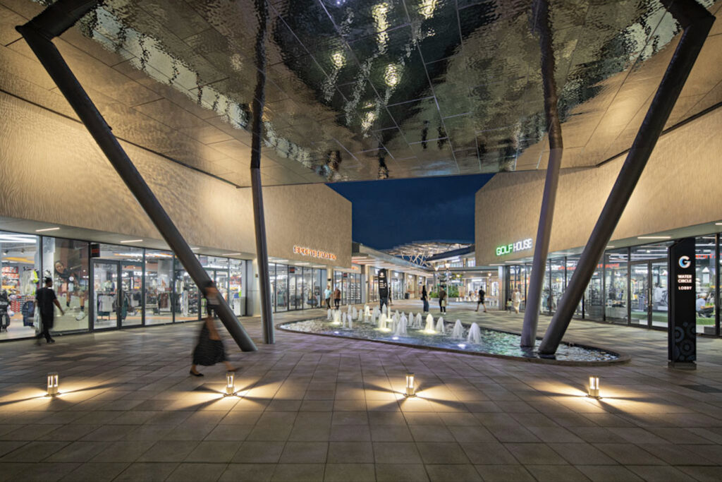 Under a Rainforest Roof 1 The reflective roof in Water Square mirrors the ripples in the water feature, enhancing the ambiance with dynamic reflections and visual depth