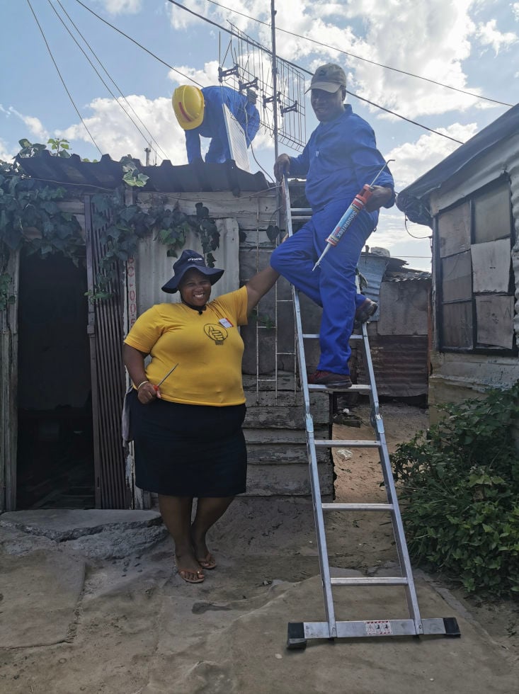 From Darkness to Dignity | Empowering African refugee communities and informal settlements | The PJS Informal Settlement installation team in action. Photo: Stephanie Briers