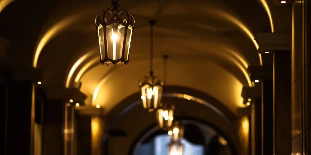 IES Dallas Section | Lighting in Architecture: Enlightened Thoughts | Hall with classic luminaire with warm light
