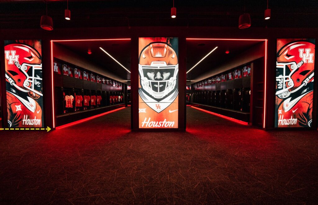 Project in Pictures: Entering Cougar Territory | Bold red toe-kick lighting and accent portals add depth to locker zones.