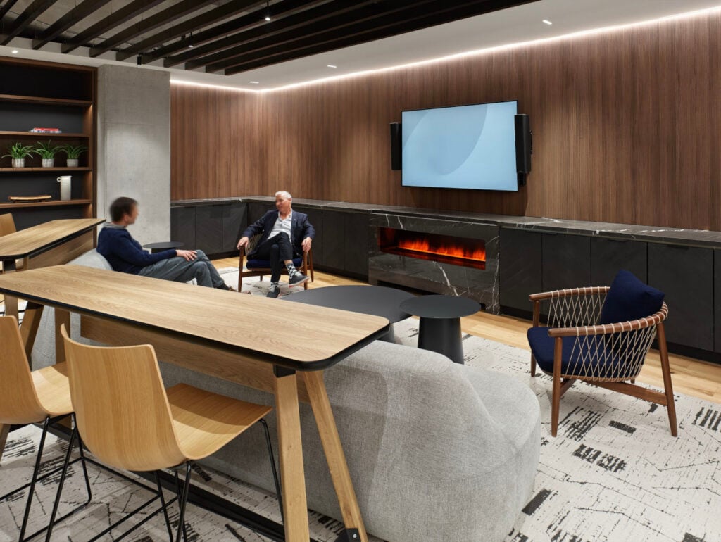 Hospitality in the Workplace 2 Hospitality in the Workplace | Hospitality in the Workplace | Cove light and millwork integrations illuminate the vertical surfaces of the library